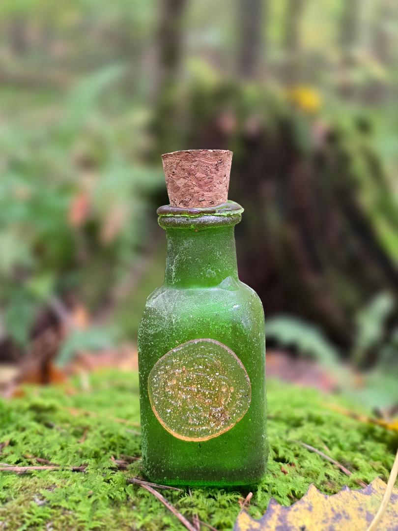 The Raven Rose Breakable Money spell bottle
